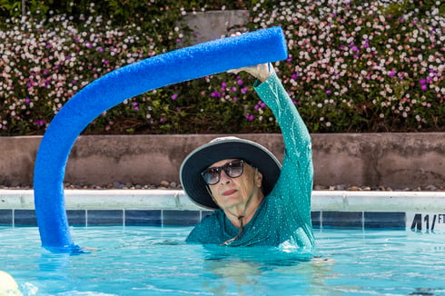 woman doing aerobics in pool